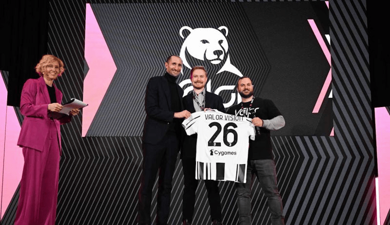 On stage at the Juventus Forward unveiling, Valor Vision receives the number 26 Forward Squad shirt